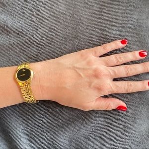 Women’s gold plated black faced Movado wristwatch early 2000’s